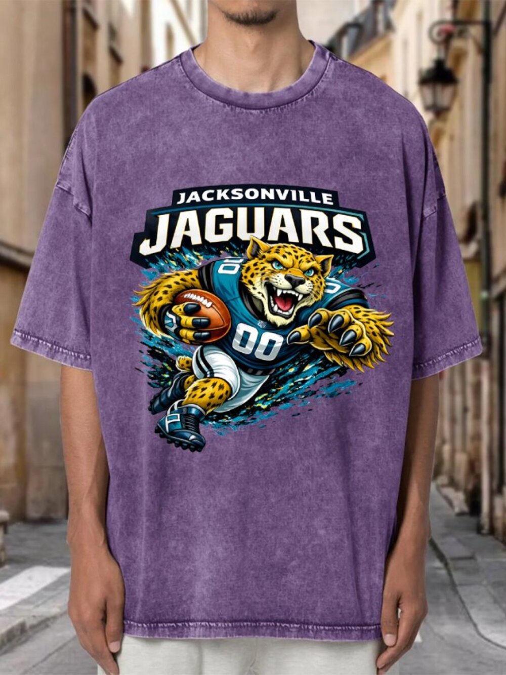 Jacksonville Jaguars Mascot NFL Purple Mineral Wash Oversized Tee A3KBGQQYAM04